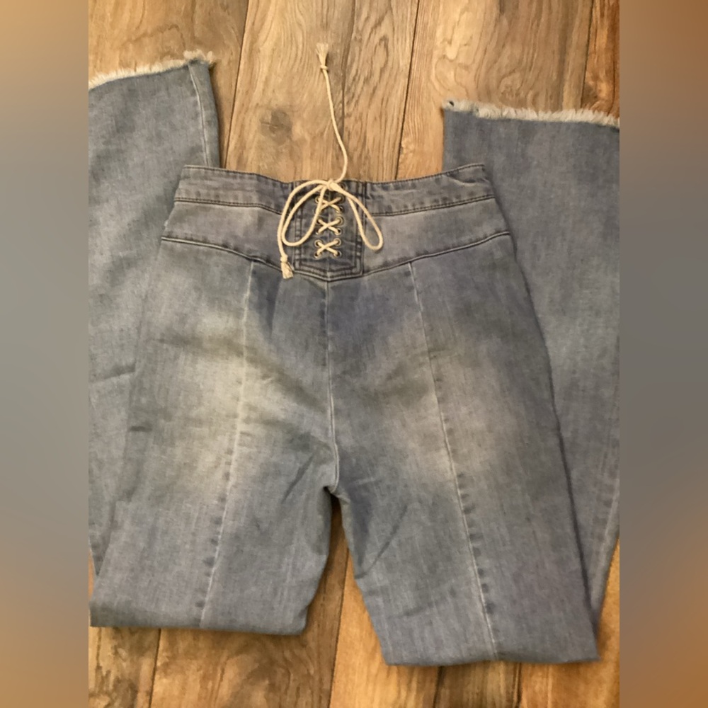 High-Rise Light Blue Flare Jeans with Lace-Up Waist